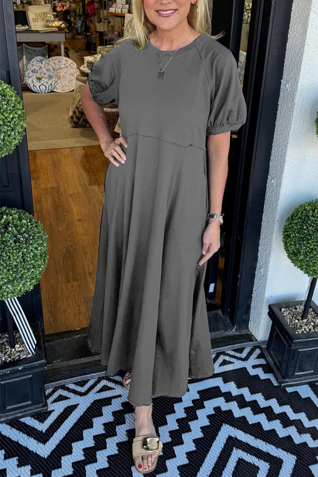 A chic long dress with a round neckline and puff sleeves