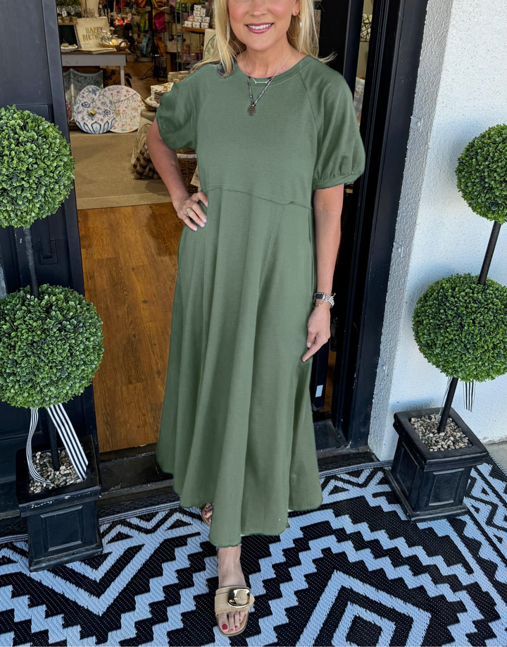 A chic long dress with a round neckline and puff sleeves