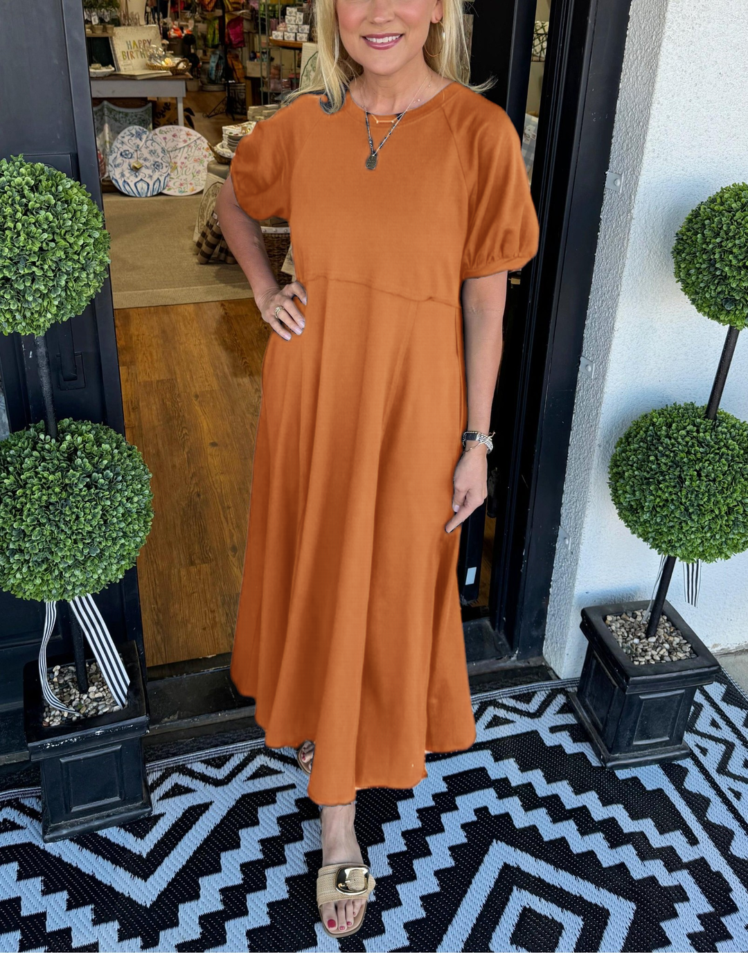 A chic long dress with a round neckline and puff sleeves